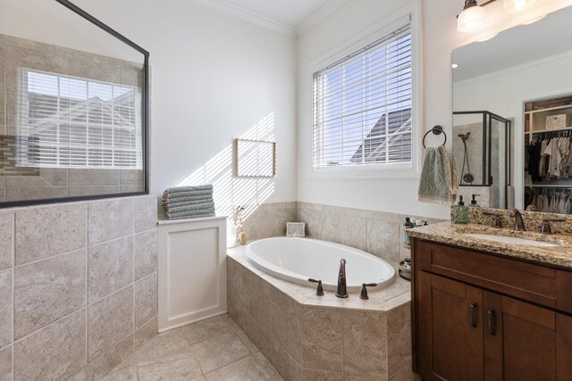 full bath featuring crown molding, a stall shower, vanity, tile patterned flooring, and a bath