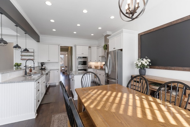 dining area with dark wood-style floors, recessed lighting, and crown molding