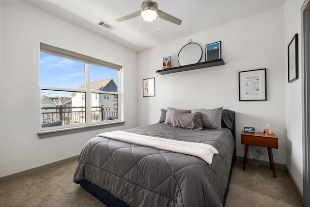 bedroom featuring carpet flooring, ceiling fan, visible vents, and baseboards