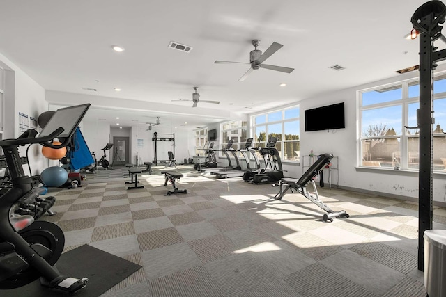 exercise room with baseboards, recessed lighting, visible vents, and light colored carpet