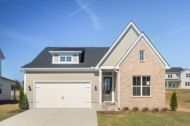 view of front of home featuring a shingled roof, concrete driveway, a front lawn, board and batten siding, and brick siding