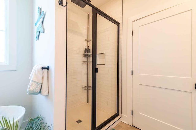 full bath with a shower stall