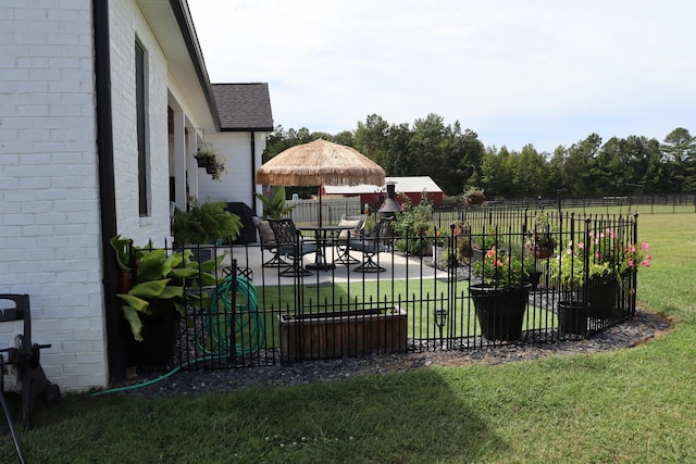 view of yard featuring fence, a patio, and a gazebo