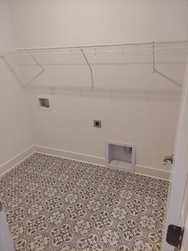 laundry area featuring laundry area, light tile patterned floors, baseboards, hookup for a washing machine, and electric dryer hookup