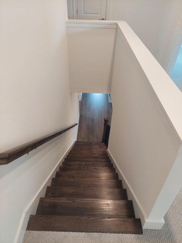 staircase featuring baseboards