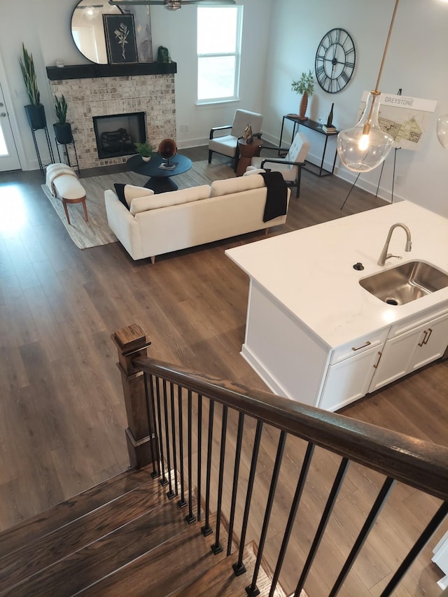 interior space with a fireplace and wood finished floors