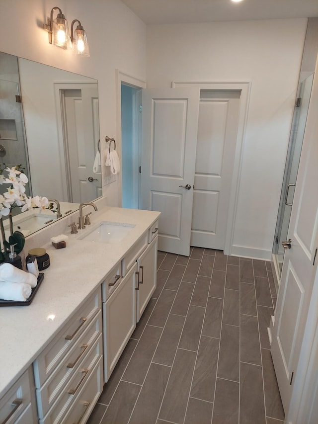 full bath featuring a shower stall and vanity