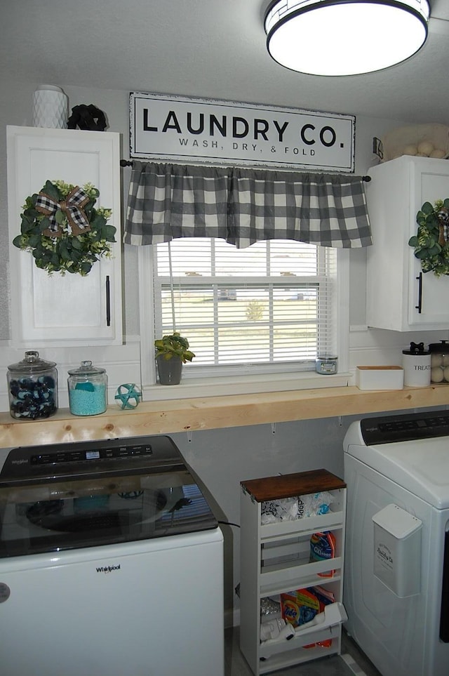 laundry area featuring cabinet space and independent washer and dryer