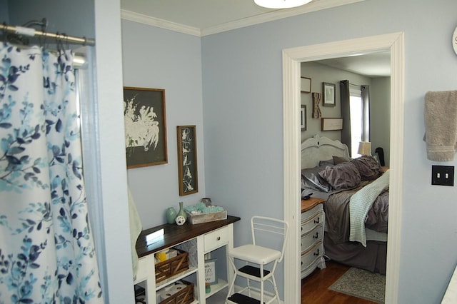 interior space with a shower with curtain, crown molding, connected bathroom, and wood finished floors