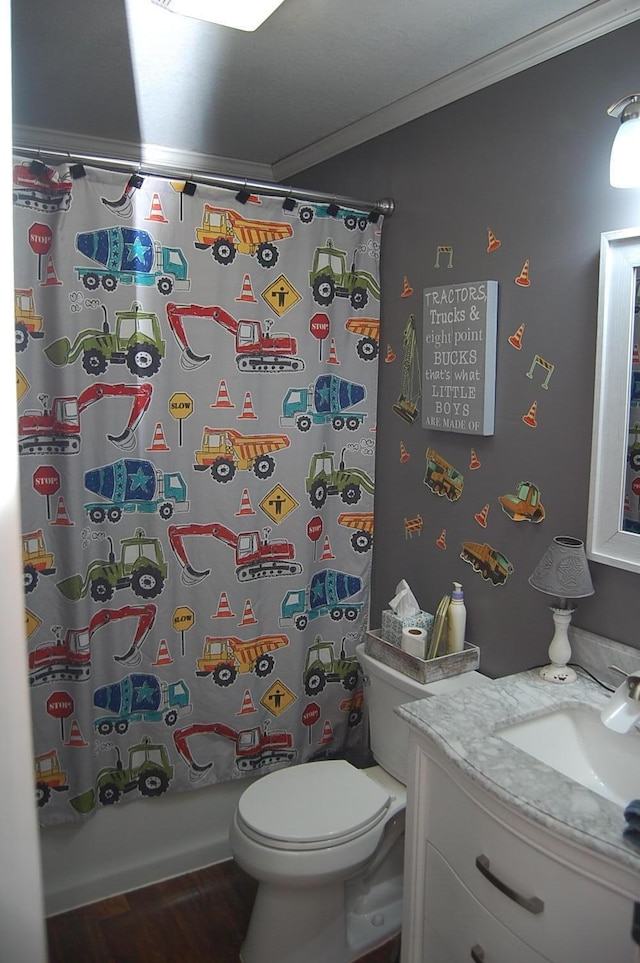 bathroom featuring ornamental molding, vanity, toilet, and shower / bath combo with shower curtain