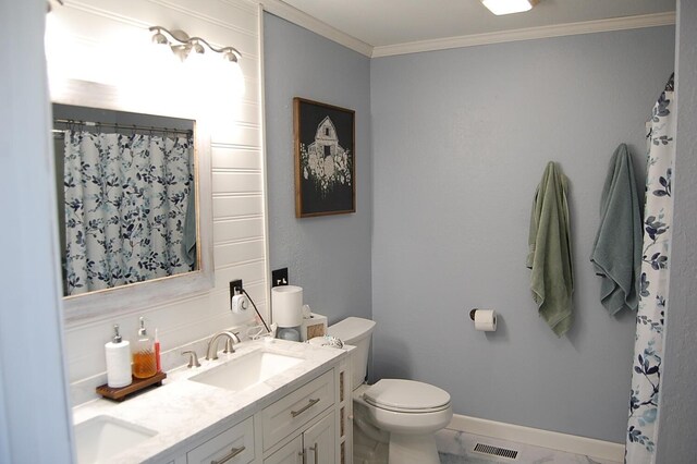 bathroom featuring double vanity, visible vents, toilet, crown molding, and a sink