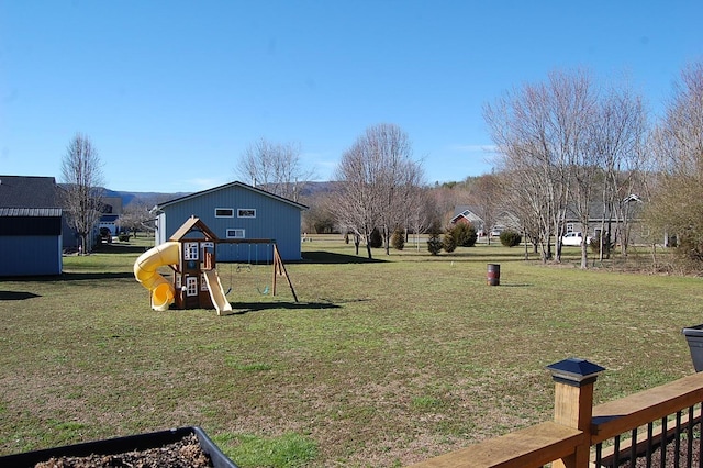 view of yard featuring playground community