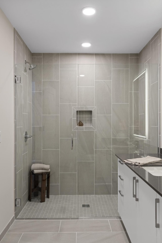 full bath featuring recessed lighting, a stall shower, and vanity