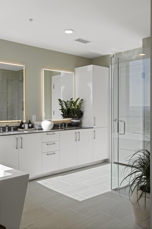 full bath featuring visible vents, a stall shower, recessed lighting, tile patterned flooring, and vanity