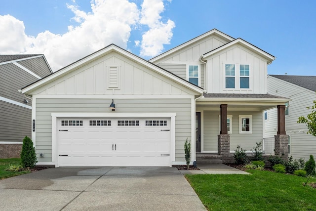 craftsman inspired home featuring a porch, concrete driveway, an attached garage, board and batten siding, and a front lawn