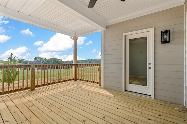 wooden terrace with a ceiling fan