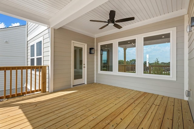 wooden terrace featuring a ceiling fan