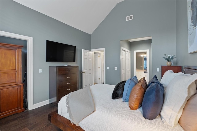 bedroom featuring visible vents, dark wood-type flooring, ensuite bath, high vaulted ceiling, and baseboards