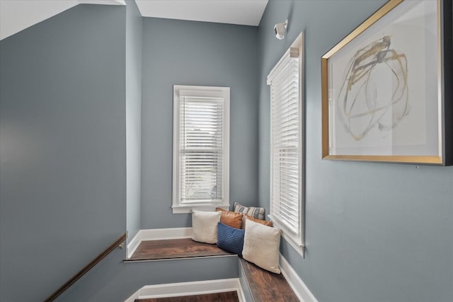 interior space featuring baseboards and wood finished floors