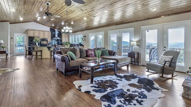 living area featuring vaulted ceiling, french doors, wood finished floors, and wood ceiling