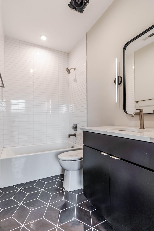 bathroom with shower / bathing tub combination, vanity, toilet, and tile patterned floors