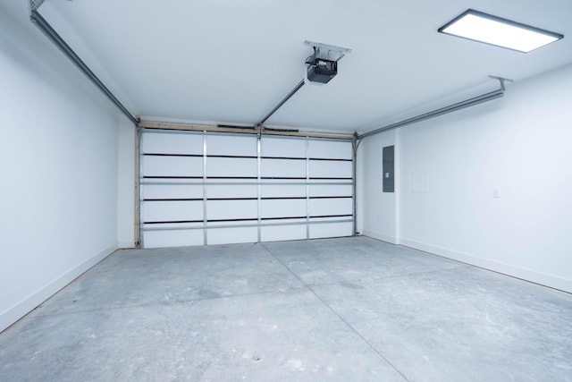 garage featuring a garage door opener, electric panel, and baseboards