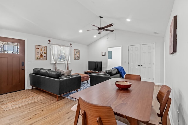 dining space with light wood finished floors, recessed lighting, vaulted ceiling, ceiling fan, and baseboards