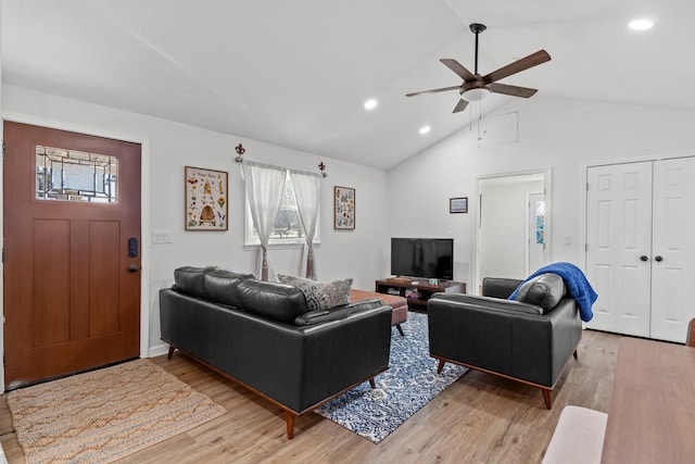 living area with a ceiling fan, light wood-type flooring, vaulted ceiling, and recessed lighting