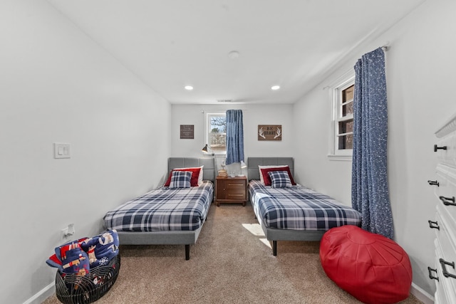 carpeted bedroom with visible vents, baseboards, and recessed lighting