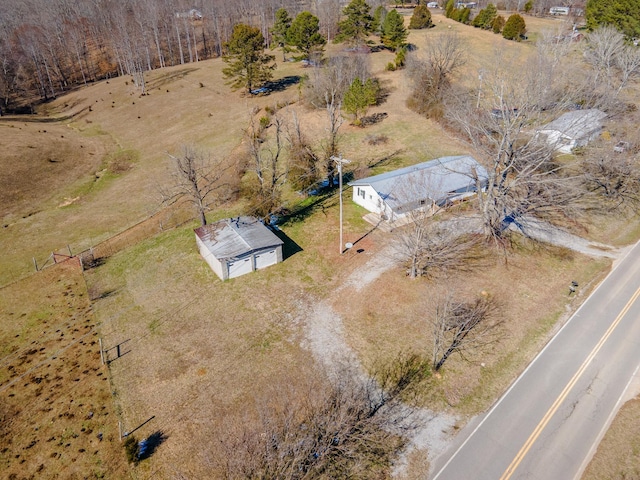 birds eye view of property with a rural view