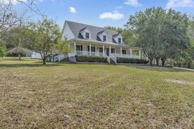 cape cod-style house with a porch, stairway, and a front yard