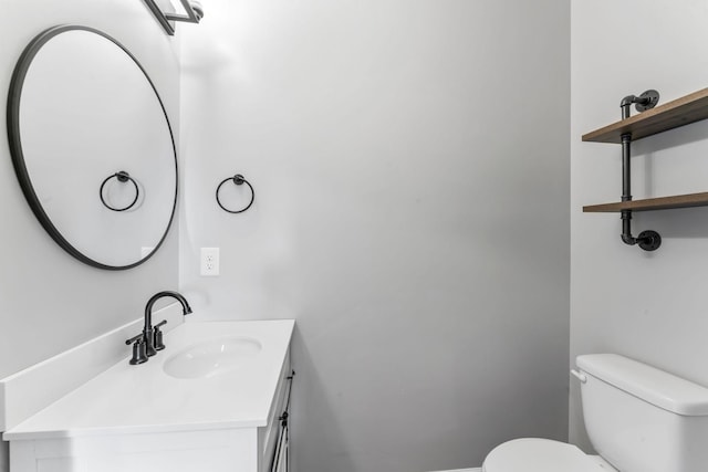 half bath with vanity and toilet