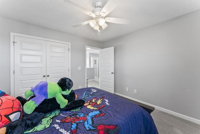 bedroom with a closet, carpet flooring, ceiling fan, and baseboards