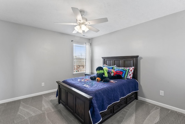 carpeted bedroom with a textured ceiling, baseboards, and a ceiling fan