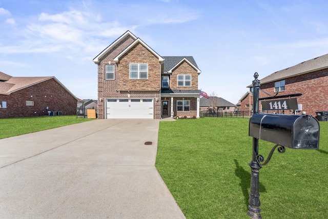 view of front of house featuring brick siding, fence, driveway, and a front lawn