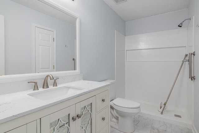 full bathroom featuring visible vents, toilet, marble finish floor, walk in shower, and vanity