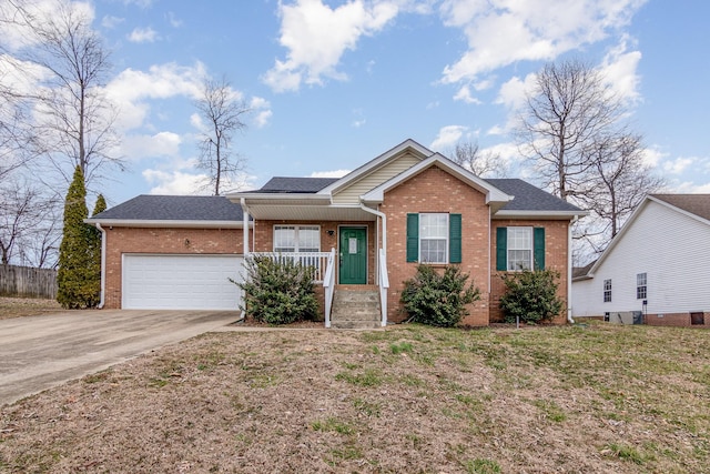 ranch-style house with an attached garage, covered porch, brick siding, a shingled roof, and concrete driveway