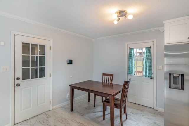 dining area with ornamental molding, marble finish floor, and baseboards