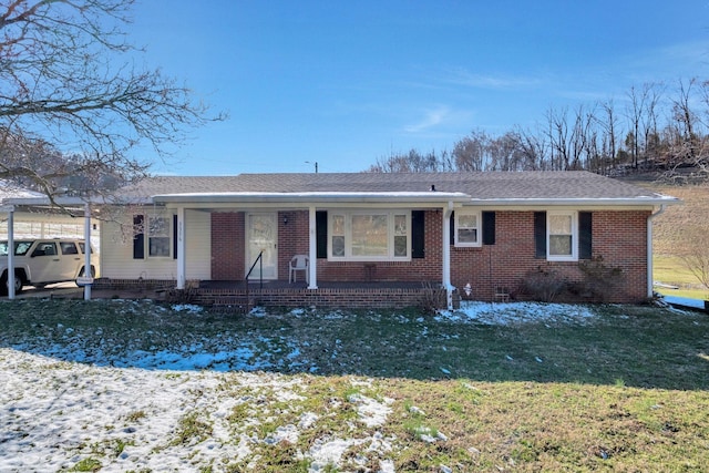 single story home featuring a shingled roof, crawl space, brick siding, and a front lawn