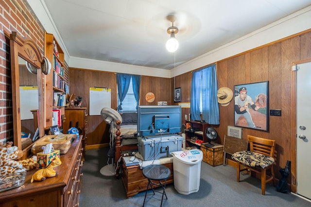 carpeted office space featuring wooden walls and crown molding