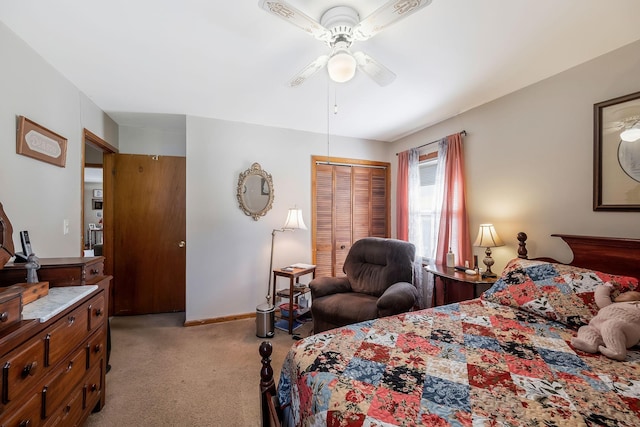 bedroom featuring light carpet, ceiling fan, a closet, and baseboards