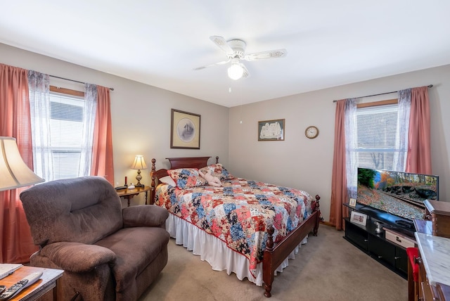 bedroom with light carpet and ceiling fan