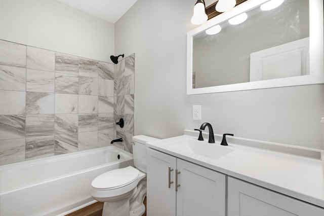 bathroom featuring  shower combination, toilet, wood finished floors, and vanity