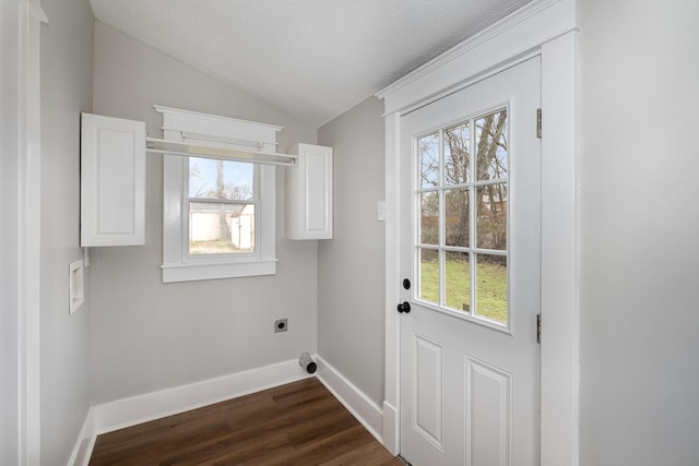 laundry area with cabinet space, baseboards, dark wood-style flooring, and electric dryer hookup