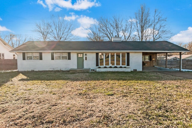 single story home featuring a carport, a front yard, fence, and a chimney