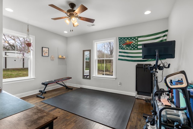 exercise area with baseboards, dark wood finished floors, a wealth of natural light, and recessed lighting