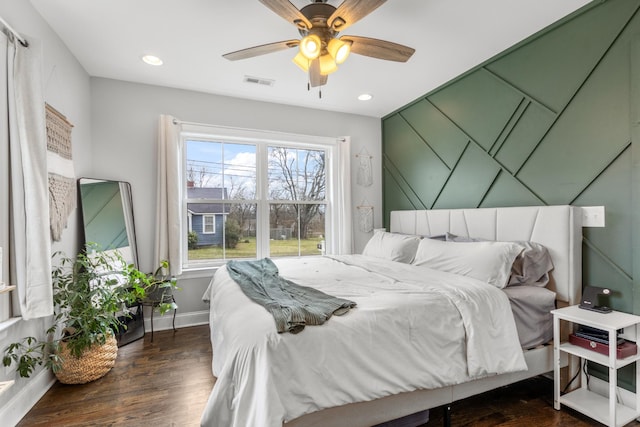 bedroom with ceiling fan, recessed lighting, visible vents, baseboards, and dark wood-style floors