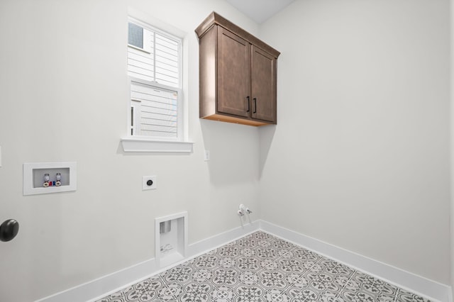 washroom with cabinet space, baseboards, hookup for a gas dryer, washer hookup, and electric dryer hookup