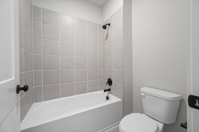 bathroom with washtub / shower combination and toilet