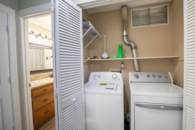 laundry room featuring laundry area and washer and clothes dryer